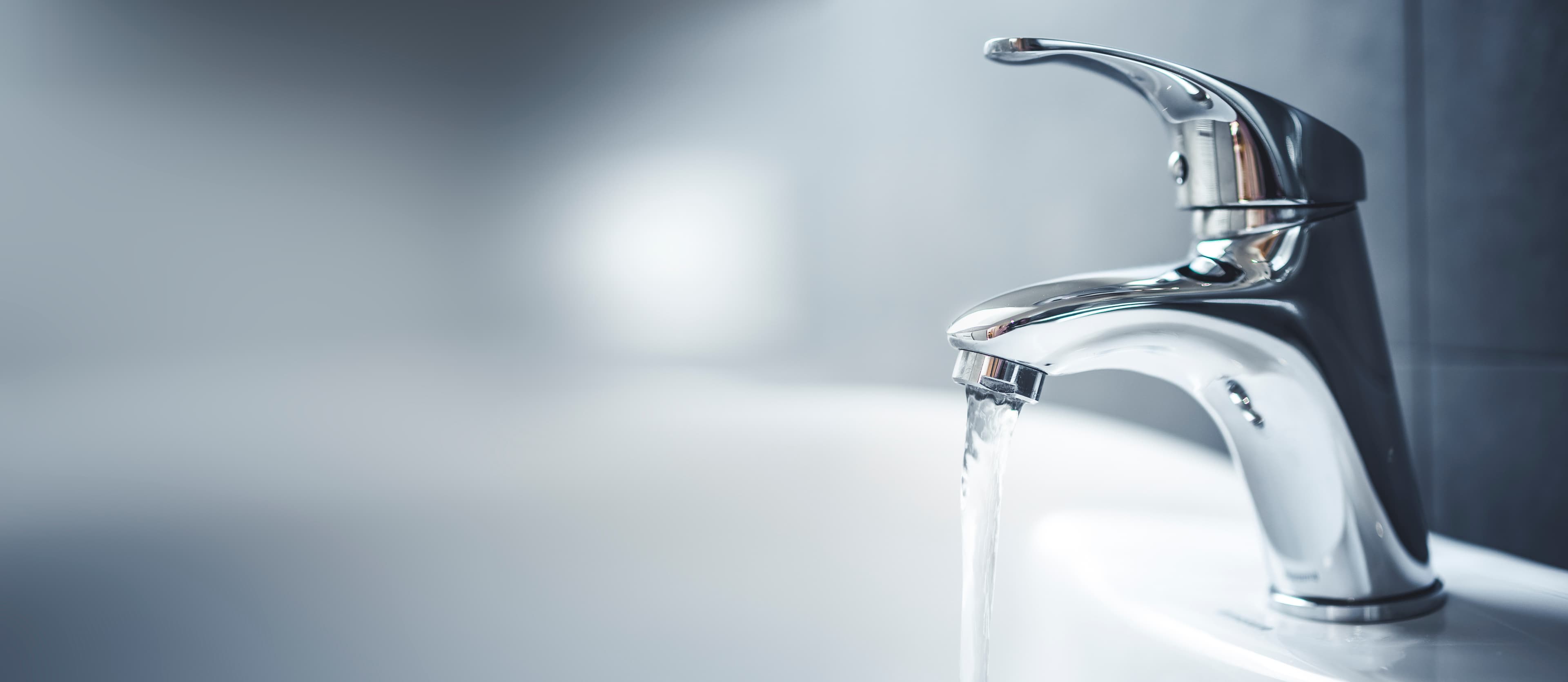 Clear, restored water flowing from the household tap after combination treatment